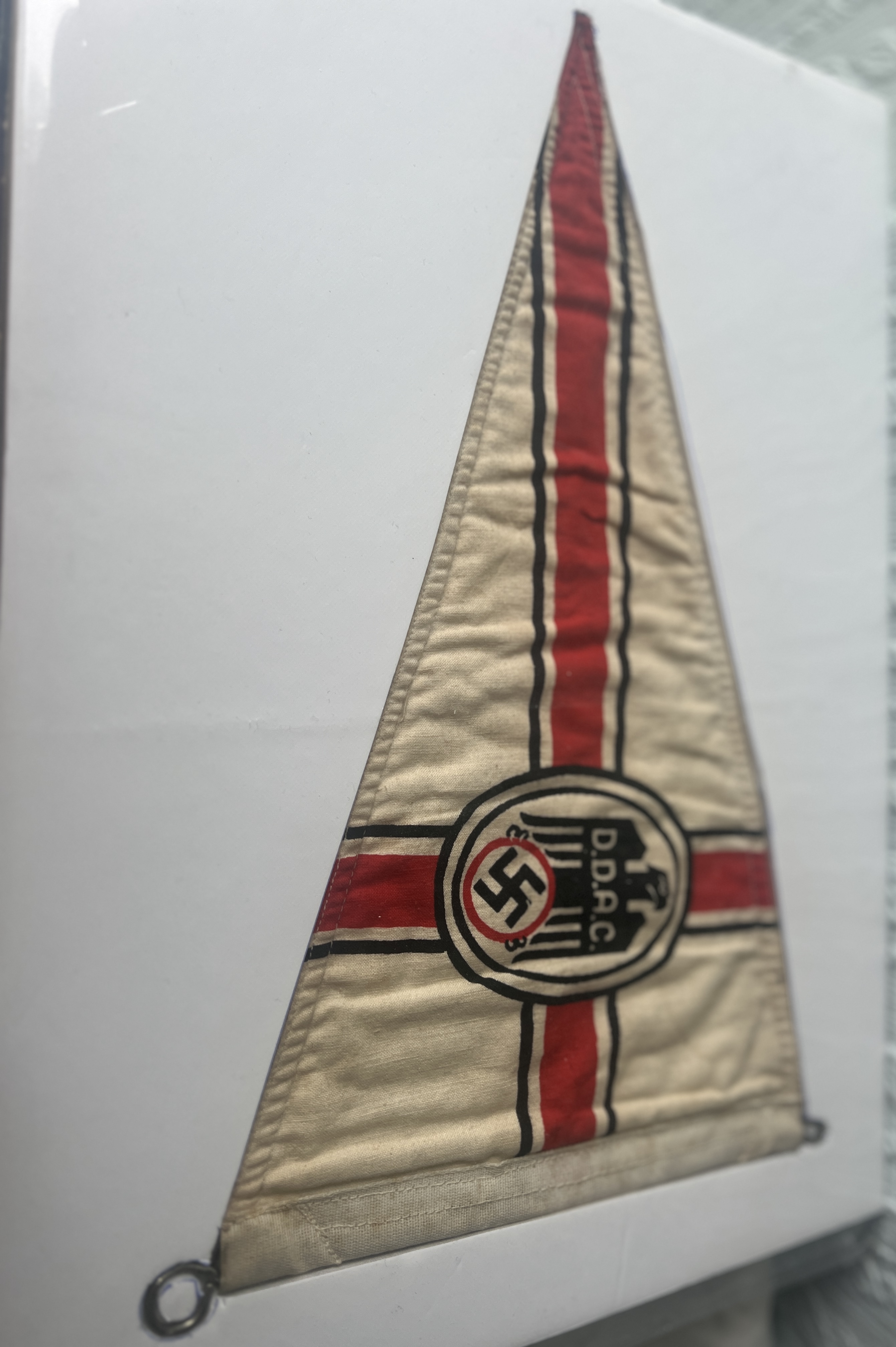 overall impression modern art deco design, black eagle with swastika, triangular pennant in red white and black